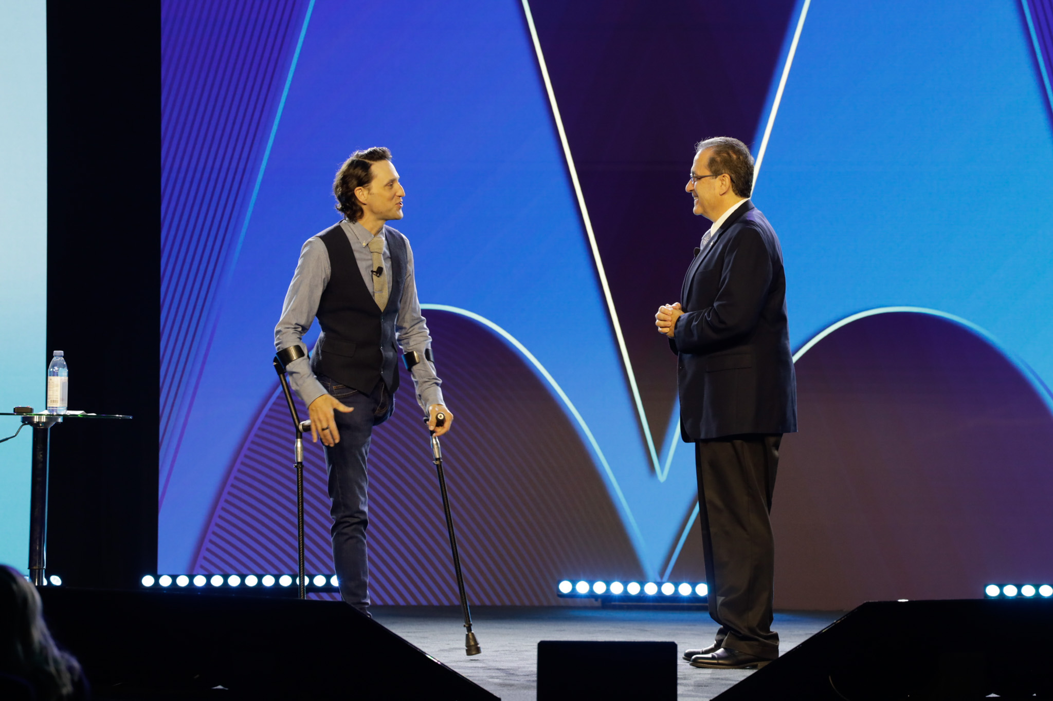 Keynote speaker on stage during event photography coverage by 2mm Headshots