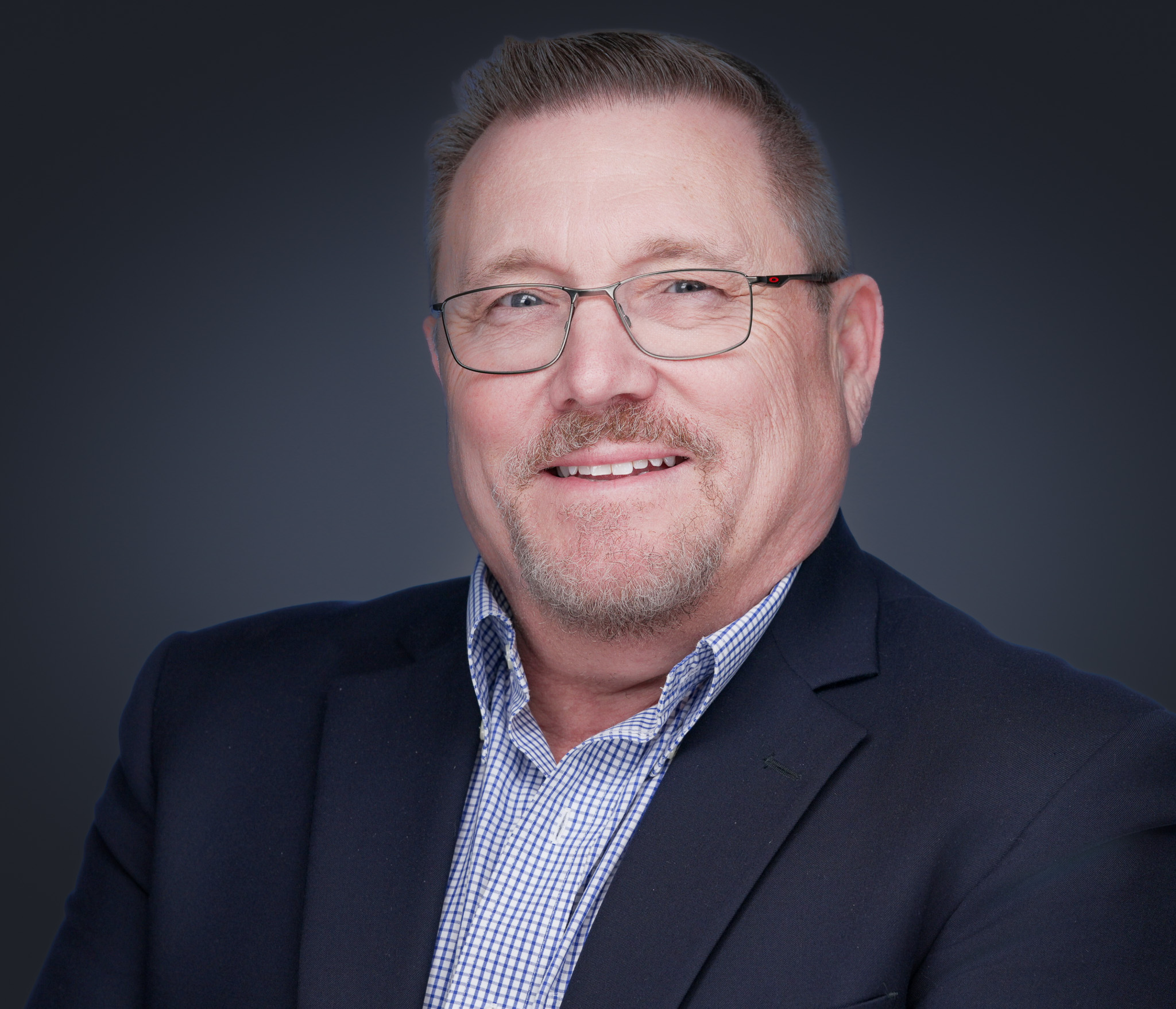 Professional executive headshot of a DFW business leader photographed by 2mm Headshots and Event Photography.