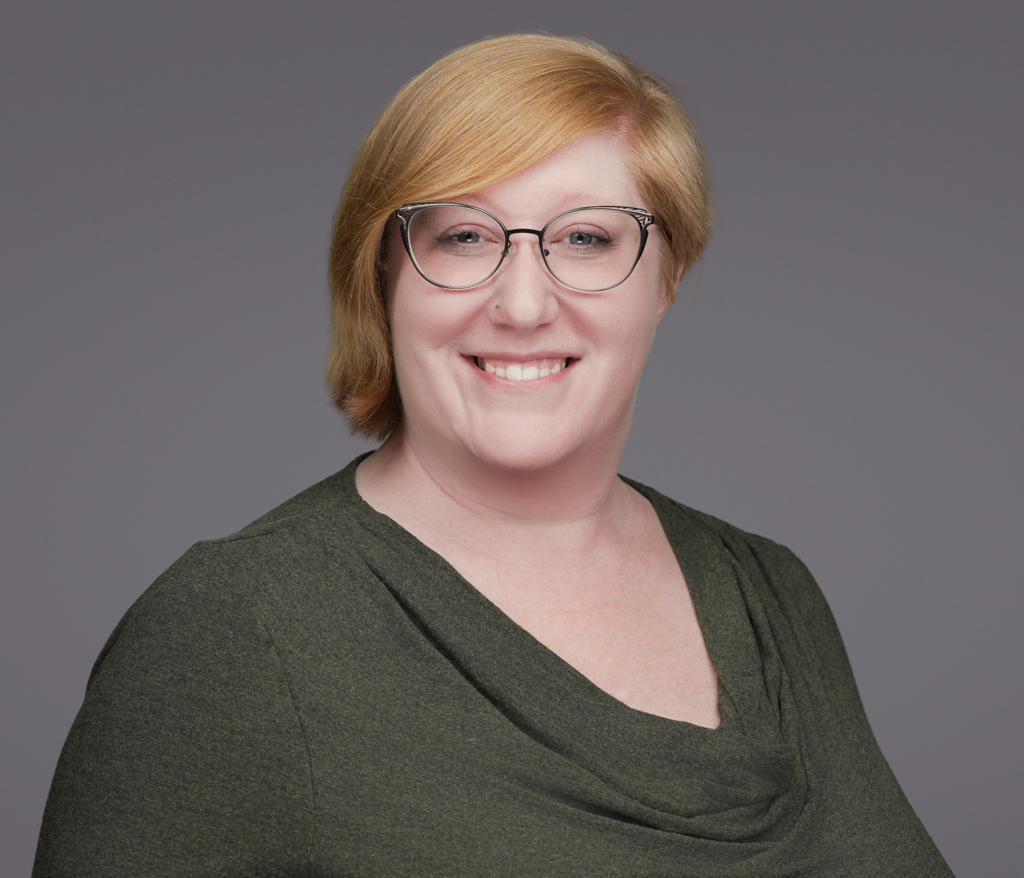 Female DFW physician portrait in white coat with warm-confident expression for OB/GYN, family medicine, internal medicine, pediatrics, and women's health specialties by 2mm Headshots
