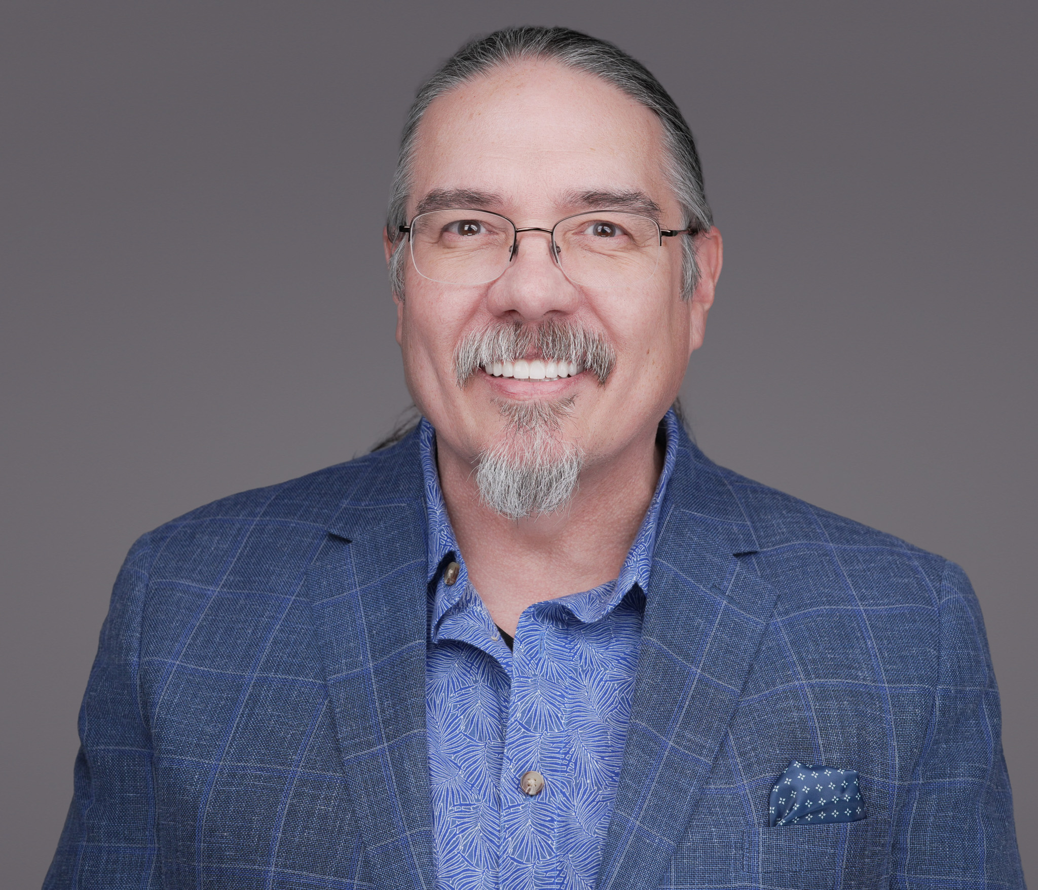 Composite showing a matched DFW multi-provider practice — physicians, NPs, PAs, and clinical staff all photographed with consistent lighting, background, and finishing for a unified practice website team page by 2mm Headshots
