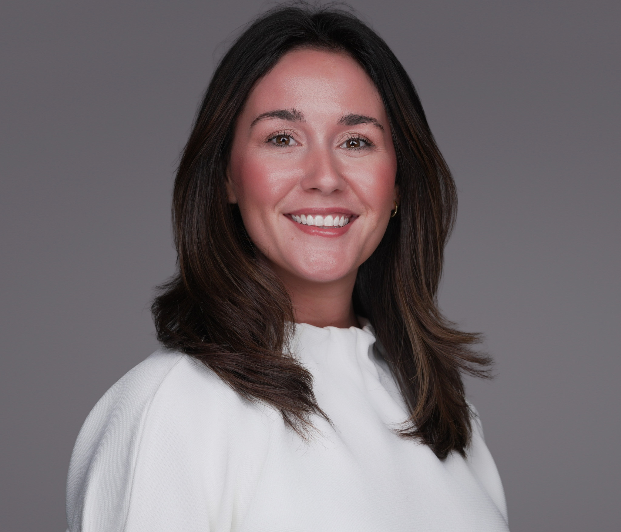 DFW realtor photographed in their local farming area / neighborhood landmark (Southlake Town Square, Highland Village shops, downtown Fort Worth Cultural District, Legacy West, or similar recognizable local landmark) by 2mm Headshots
