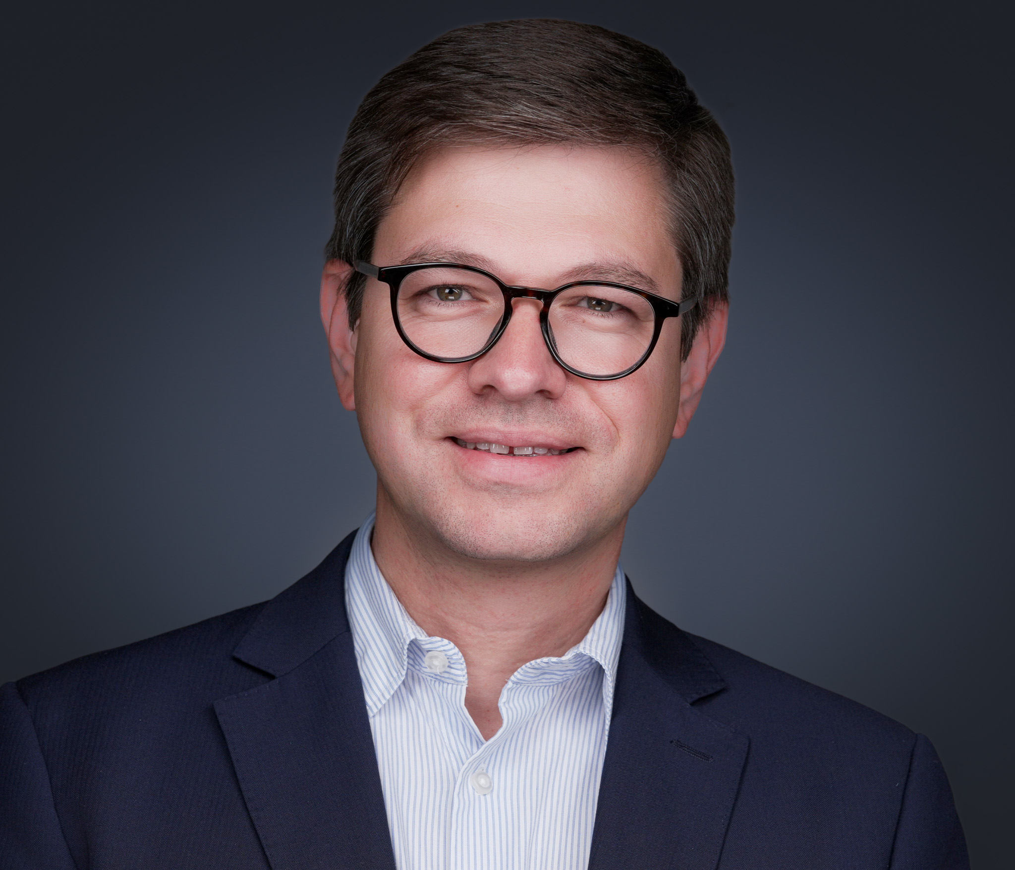 Executive headshot of a confident CEO photographed for board and press use
