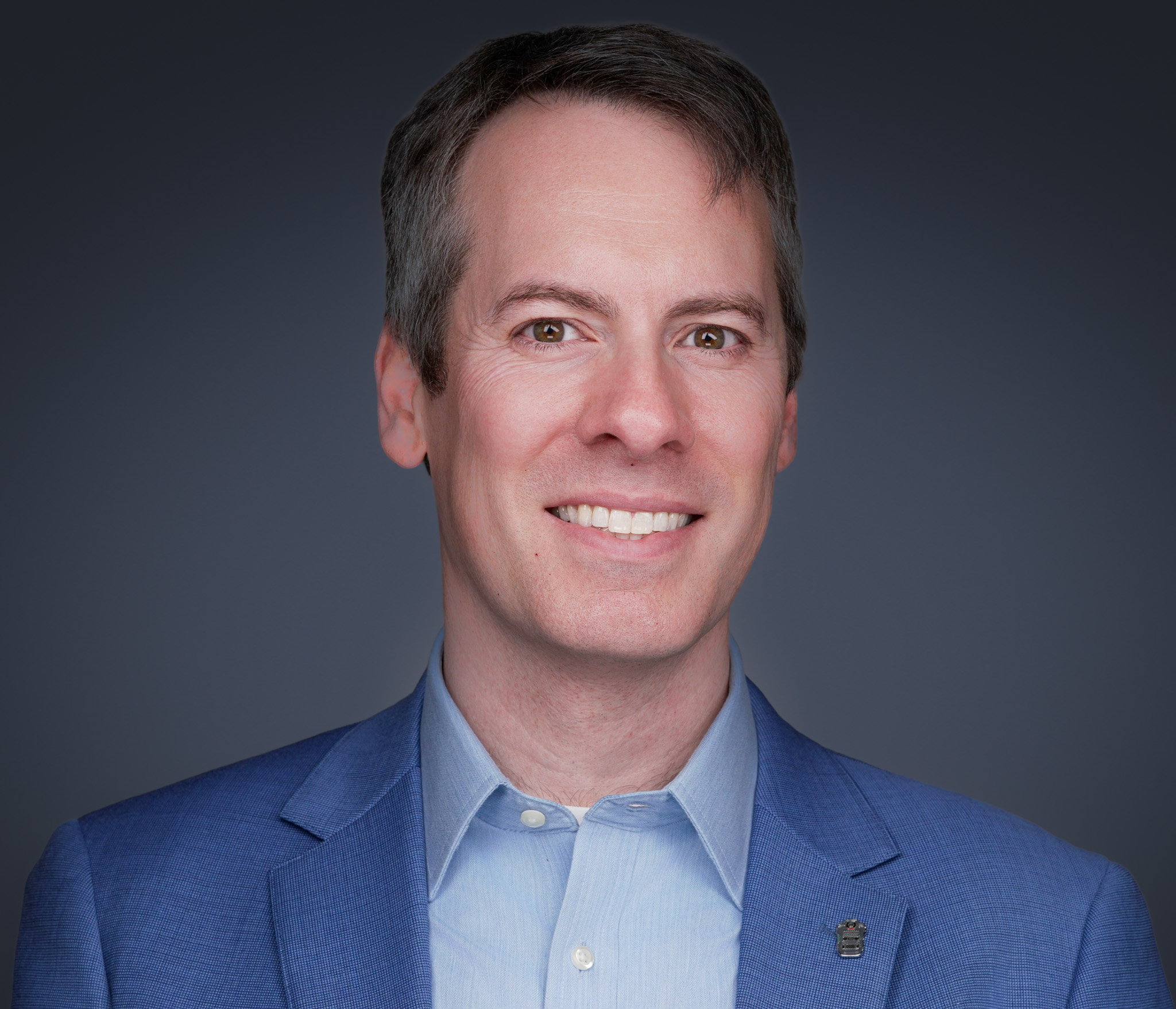 Mobile studio team headshot session photographed on-site at a Las Colinas corporate office