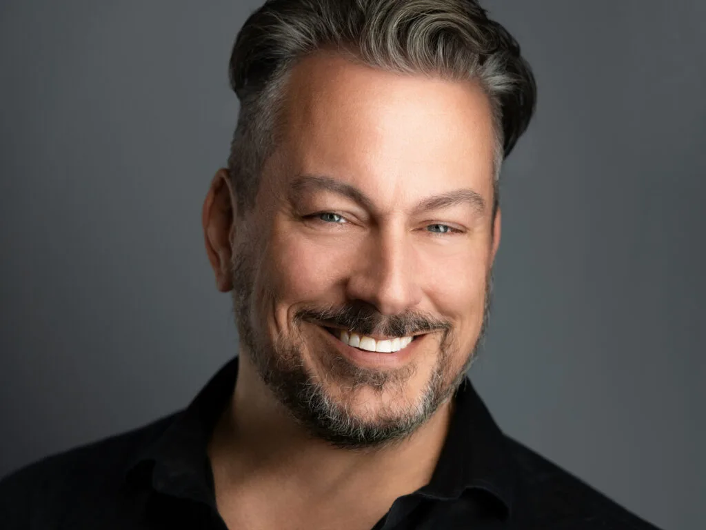 Confident DFW professional photographed by 2MM Headshots using the 2MM Method